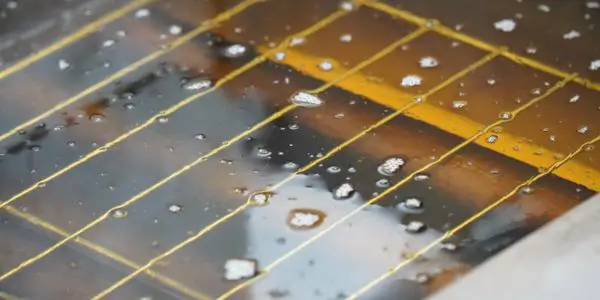 Raindrops on solar panel surface.